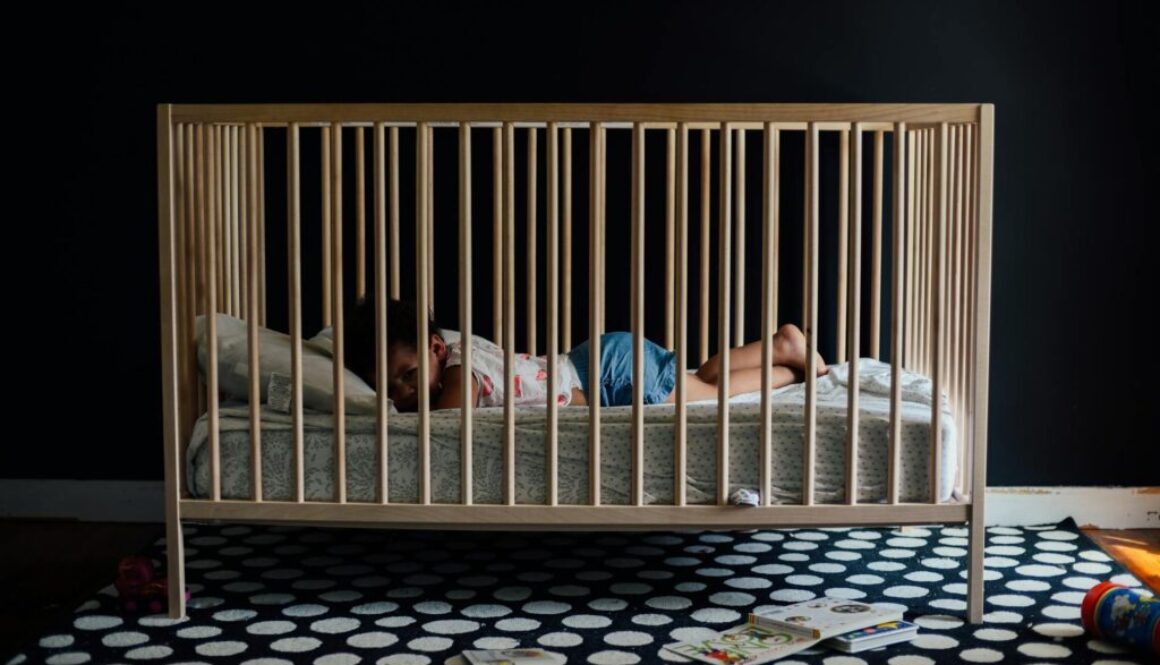 toddler in a crib