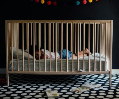 toddler in a crib